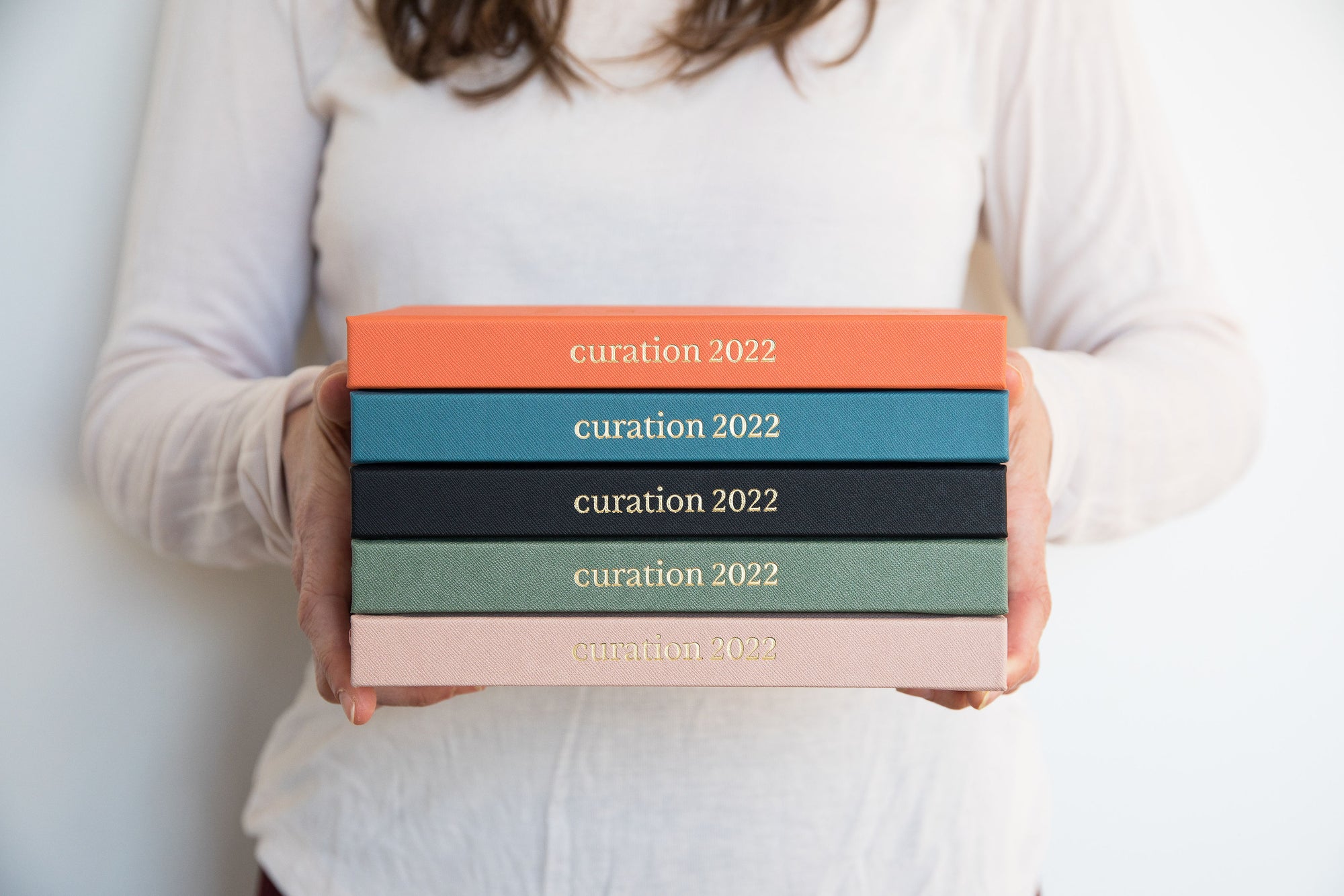 Person holding Curation diaries