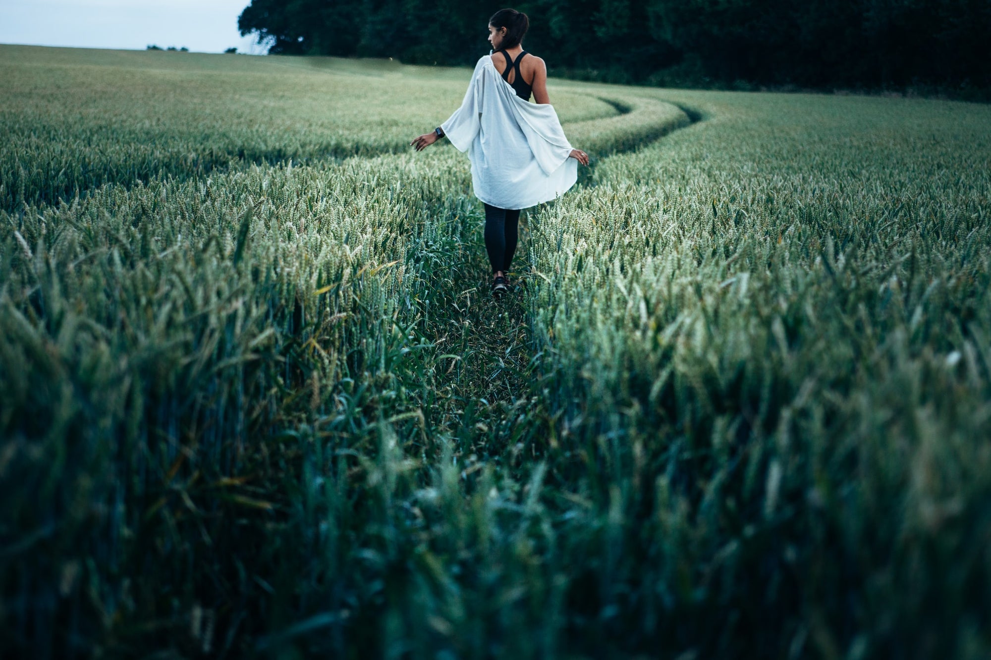 Person walking through a field