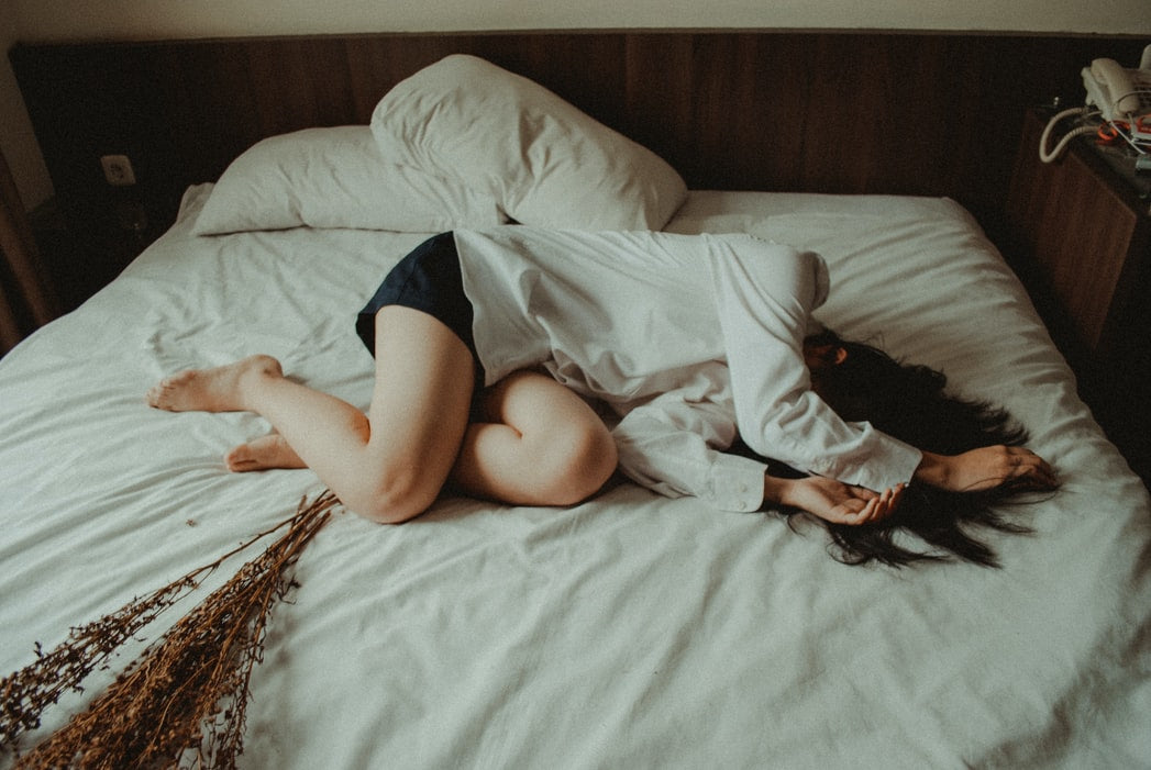 Person laying on a bed