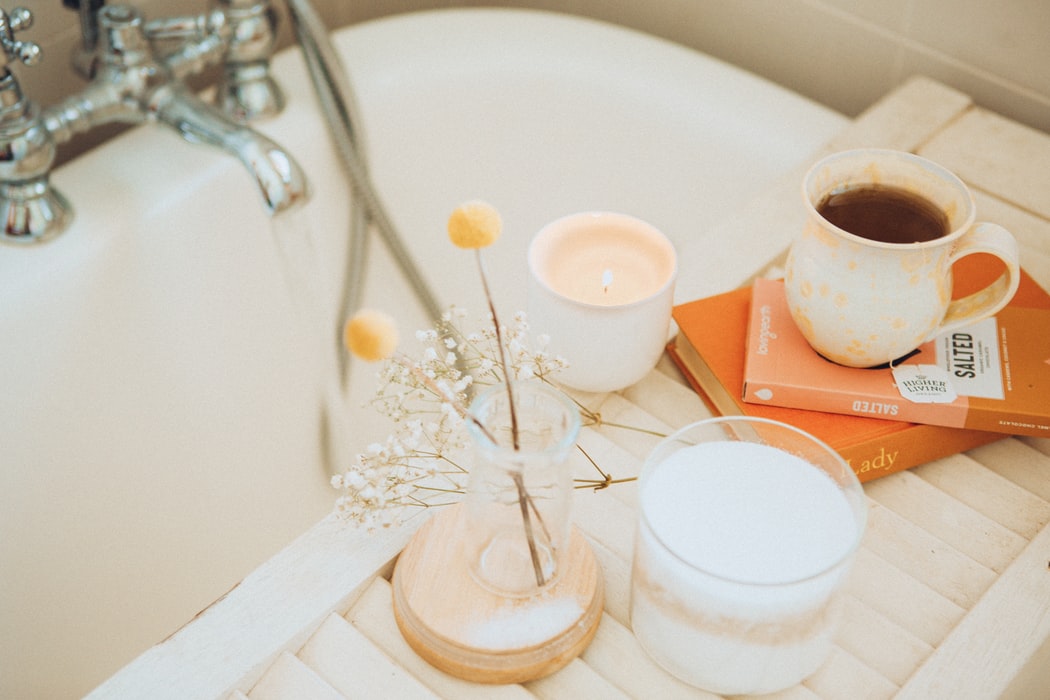 Running bath with a cup of tea