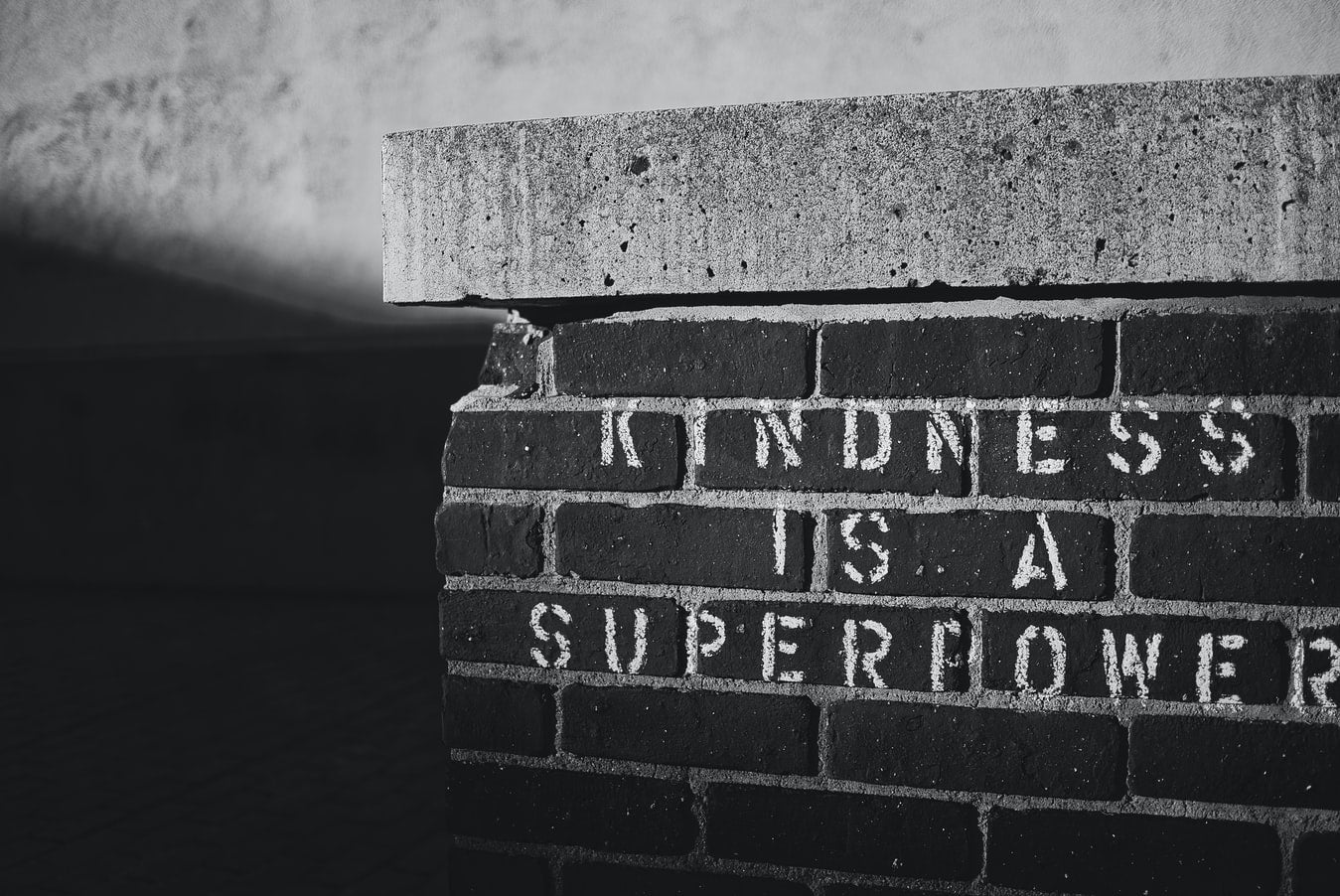 Brick with "Kindness is a superpower" written on it