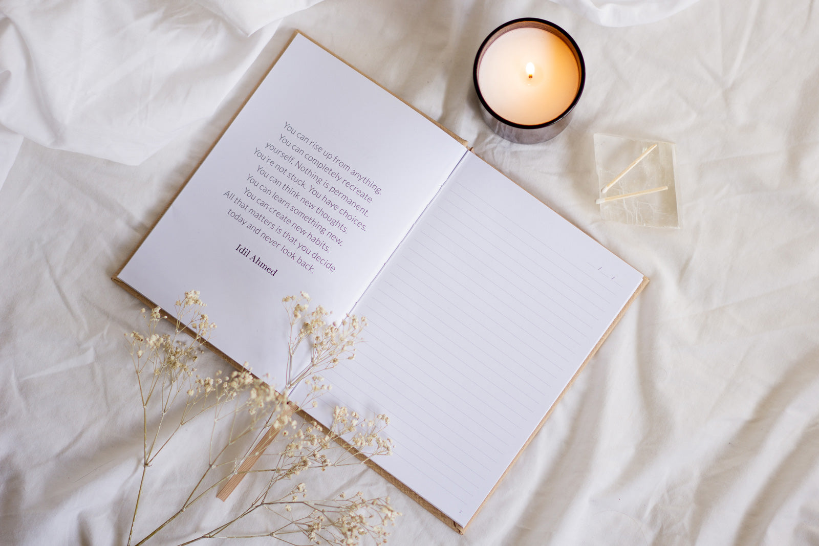 Saint Belford journal open on a bed
