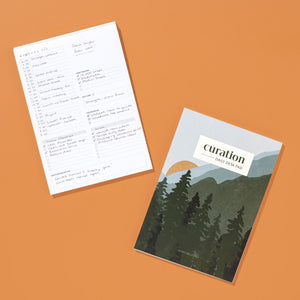 Curation Daily Desk Pad Planner on Orange Background